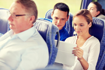 Fototapeta na wymiar happy couple with tablet pc in travel bus