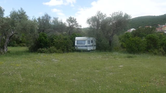 The trailer in the woods. Homes forest. Olive grove.