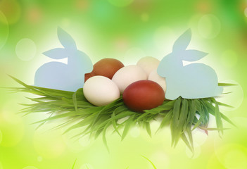 Easter. Rabbits and colorful eggs in the grass.