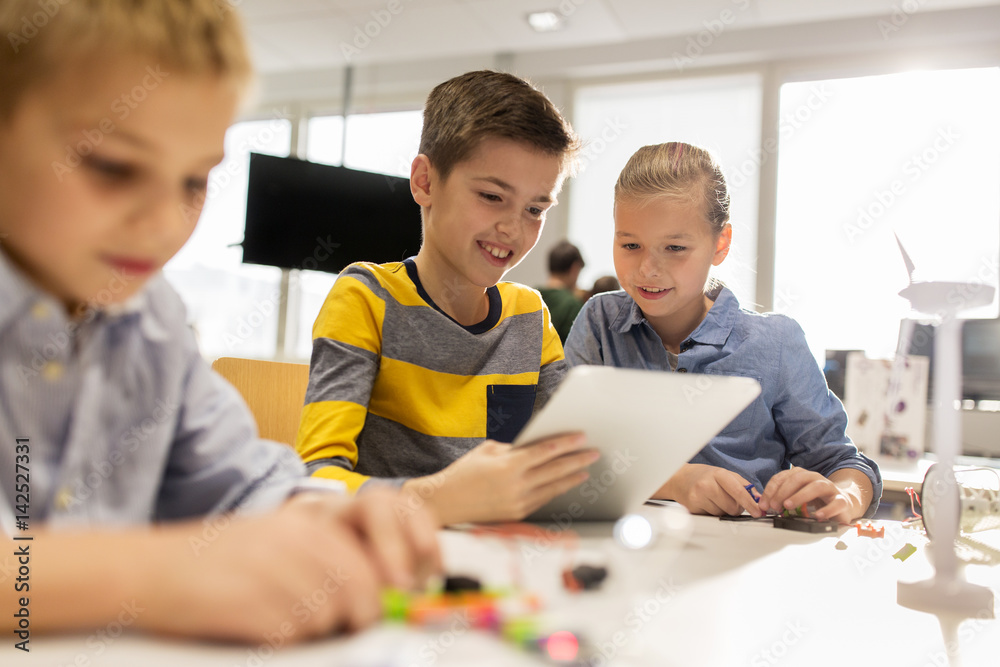Wall mural kids with tablet pc programming at robotics school