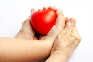 Old Woman And Child Are Holding A Heart Shape