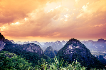 Sunset over karst landscape by Yangshuo in China