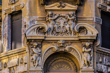 Typical Old Italian house with sculptures. Rome.