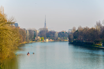 view of the parco del valentino with po river, Mole Antonelliana and cityscape of torino at background