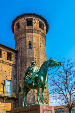 View of the Monument to Cavalieri d'Italia with castello degli acaja building on Piazza Castello in torino
