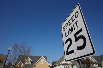 Fototapeta premium White rectangular road sign about 25 miles speed limit