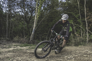 Man on mountain bike rides on the trail. Extreme Sport Concept.