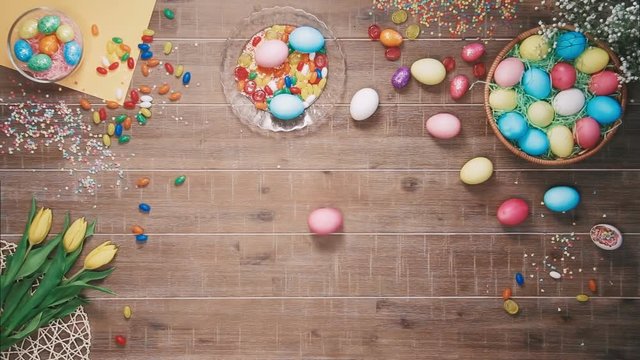 Easter egg spins on table decorated with easter eggs. Top view