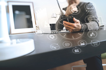 businessman working with smart phone and digital tablet and laptop computer in modern office