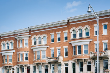 Fototapeta na wymiar Row houses on Charles Street, in Charles Village, Baltimore, Maryland.