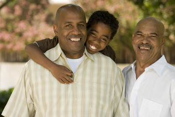 Grandfather with his adult son and grandchild. - Powered by Adobe