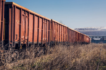 Fototapeta premium Cargo Train on Unused Railway near Storage