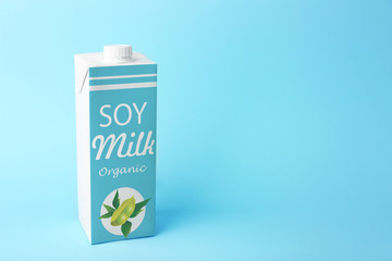 Simple milk box on color background