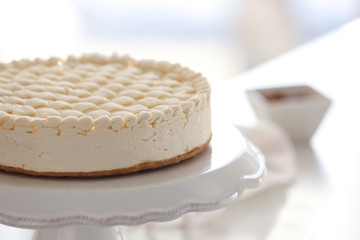 Delicious plain cheesecake on stand
