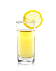 Golden tequila shot with juicy lemon slice and salt on white background