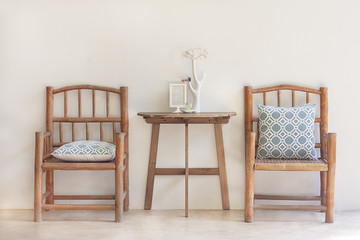love concept image. The twin wood chairs on white wall background with wood table is between....