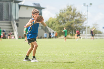Obraz premium young preteen boy playing softball on outdoor background