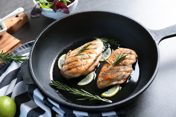 Delicious chicken breasts in frying pan