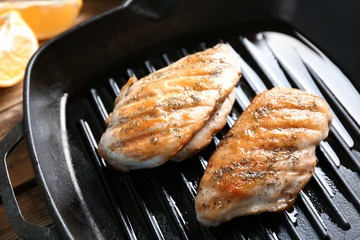Delicious chicken breasts in grill pan