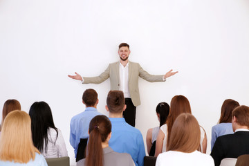 Business trainer giving presentation to group of people © Africa Studio