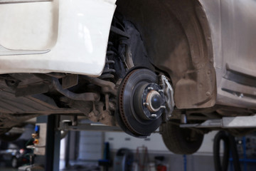 Fototapeta premium Closeup view of car without wheel