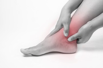 ankle injury in humans .ankle pain,joint pains people medical, mono tone highlight at ankle - obrazy, fototapety, plakaty