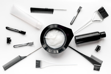Tools for hair dye in barbershop on white background top view