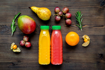 multifruit drink in plastic bottle on wooden background top view mock up