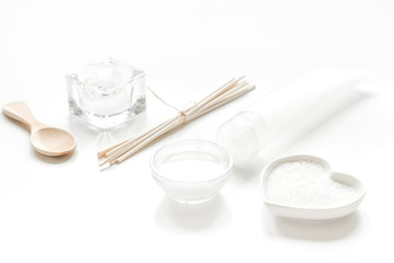 white set of cosmetics for spa on table background