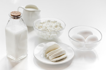 Obraz na płótnie Canvas monochrome concept with dairy products on white table