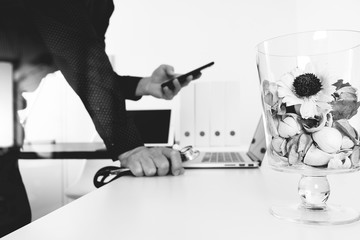 Medical technology concept. Doctor hand working with smart phone,laptop,modern digital tablet dock screen computer in modern clinic office room,virtual screen medical chart interface