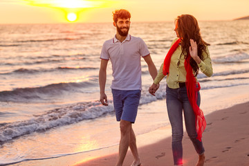 happy young romantic couple in love have fun on beautiful beach at beautiful summer day