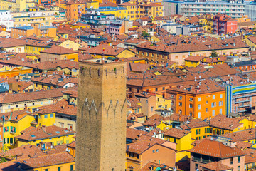 The Prendiparte Tower (also known as Coronata Tower) with a rooftop background of Bologna, Italy