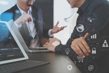 Co working team meeting concept,Man using VOIP headset with digital tablet and latop computer and smart phone in modern office
