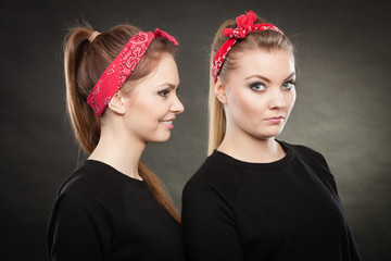 Two funny positive retro styled female portrait.