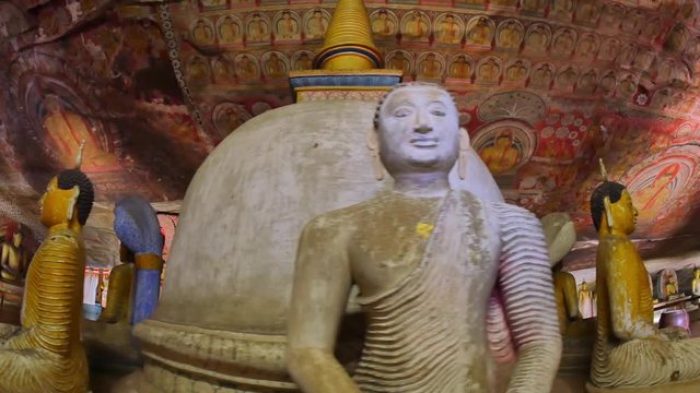 Dambulla Cave Temple or Royal Rock Temple Buddhist landmark of Sri Lanka. Famous place of worship and travel destination in Asia. Ancient Buddha sculptures in religious architecture interior