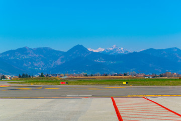 bergamo airport is situated just under the bergamo city and the alps