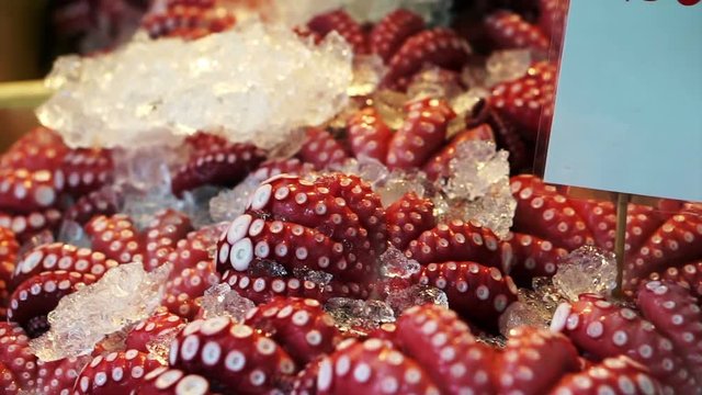 Boiled red octopus tentacles sell in Tsukiji, Japanese famous fish market
