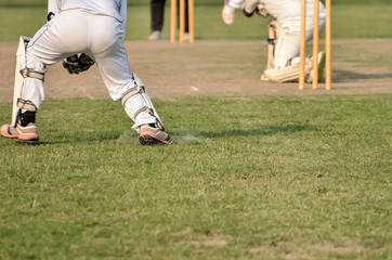 Boys are playing cricket