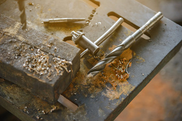 Top view of  drill bit on Drill press in industrial