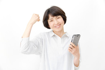 Fototapeta premium ミドル 女性 ガッツポーズ