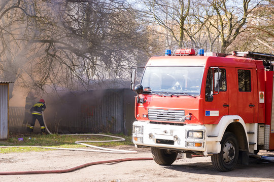 Action of fire extinguishing by firefighters in makeshift garages in Poland