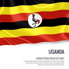 Silky flag of Uganda waving on an isolated white background with the white text area for your advert message. 3D rendering.