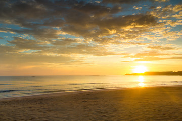 Naklejka na ściany i meble sunrise over the tropical beach