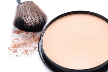 Makeup powder and brush on white background