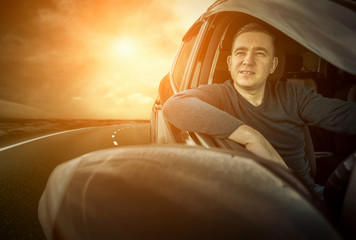 Man sitting and driving in the car.