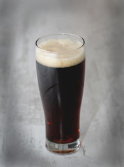 glass of dark beer isolated light