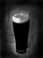glass of dark beer isolated light