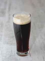 glass of dark beer isolated light