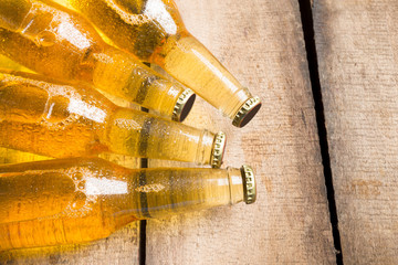 Obraz na płótnie Canvas Beer bottles on a wooden table .